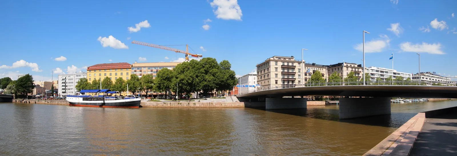 Panorama of the River Aura and Myllysilta bridge in central Turku, Finland.