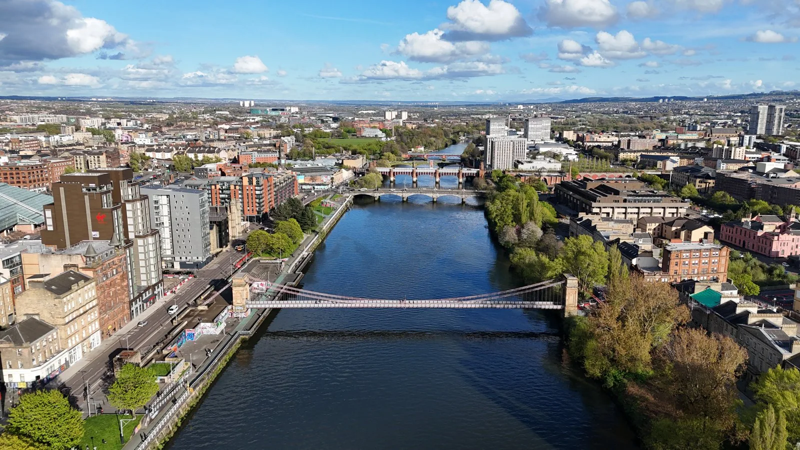 Aerial of the River Clyde through Glasgow showing the regenerated waterfront (Pacific Quay, SECC, Glasgow Harbour) and the riverside layout addressed by the Clyde Waterfront Regeneration. Glasgow City