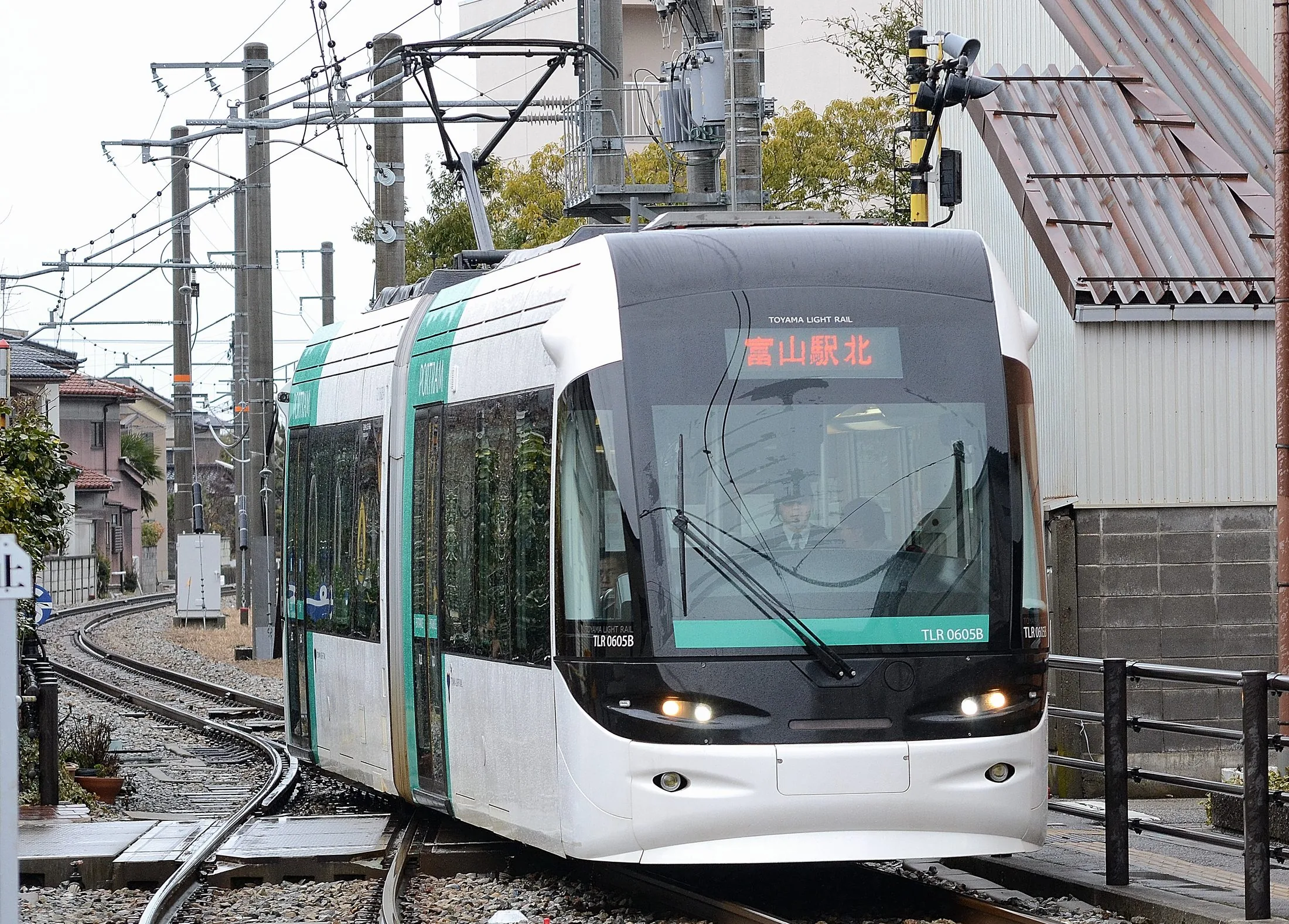 Toyama LRT vehicle at street level, representing the compact-city LRT network.