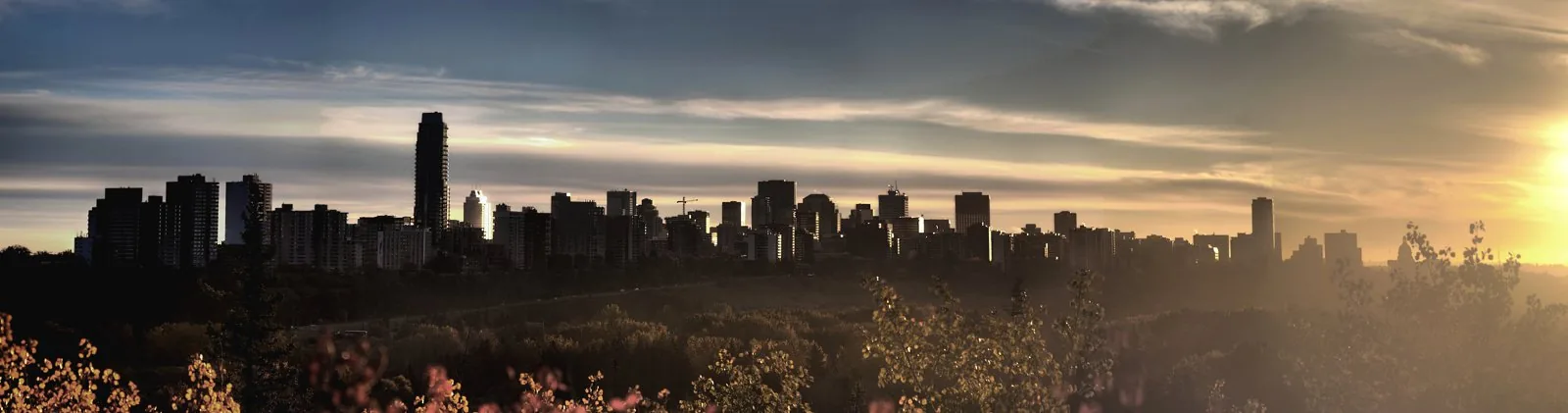 Elevated panoramic view over Edmonton's North Saskatchewan River Valley and downtown.