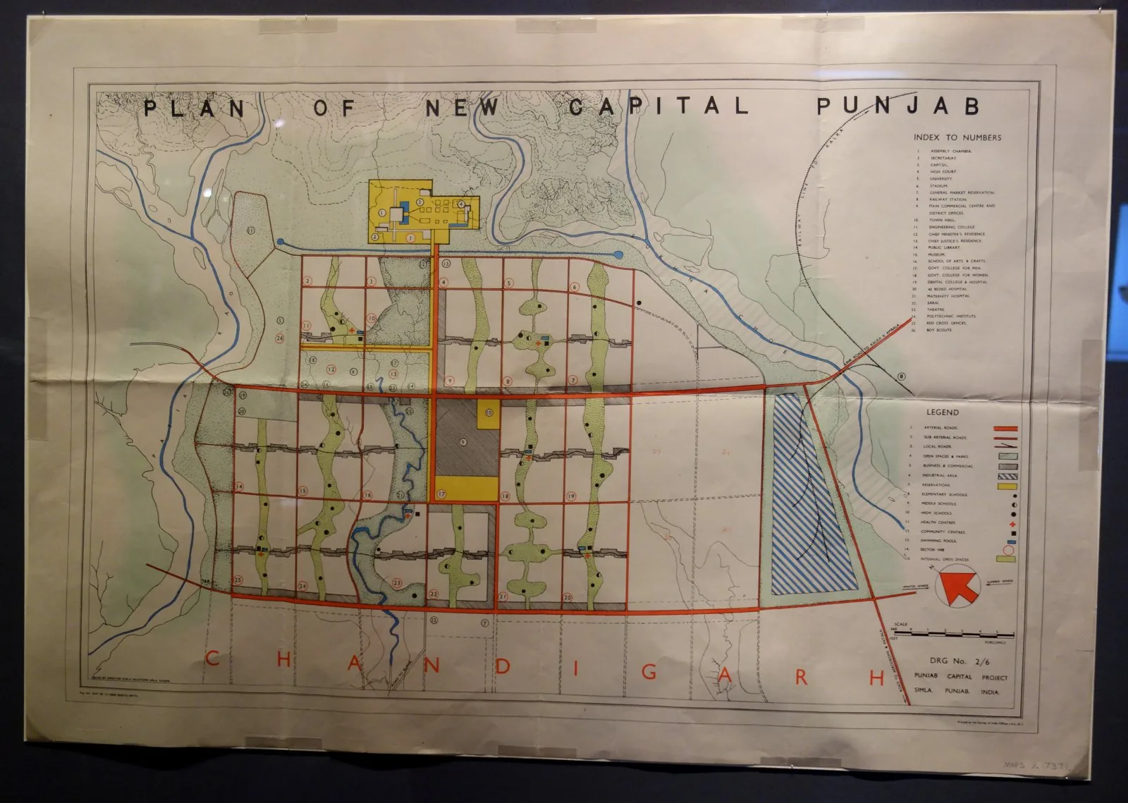 The original Chandigarh master-plan scheme drawing — 'Plan of New Capital Punjab' (Drawing No. 2/6, 1953) — showing Le Corbusier's gridiron of numbered sectors, the Capitol Complex at the head, and th