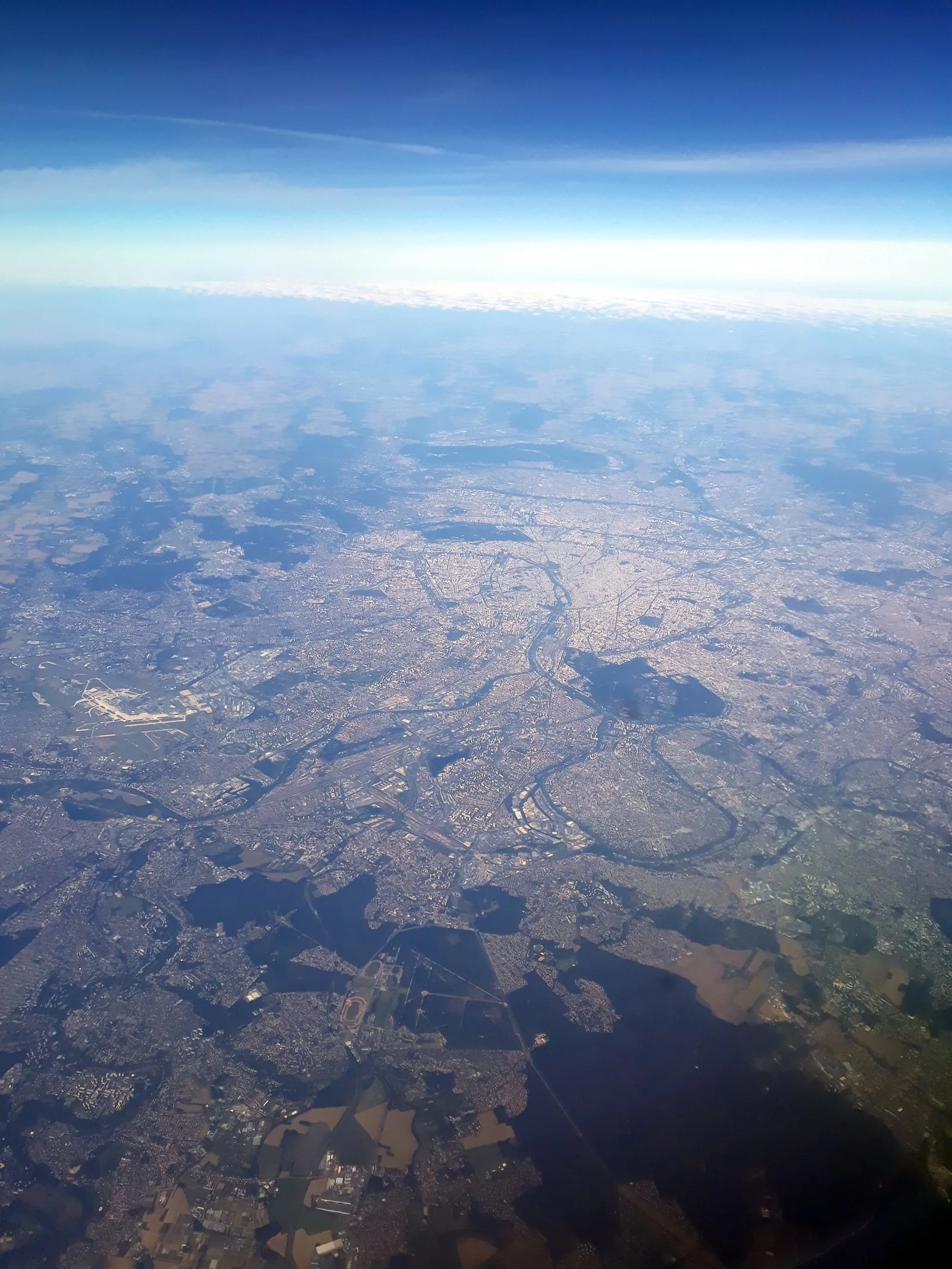 Aerial photograph of central Paris and its dense historic fabric.