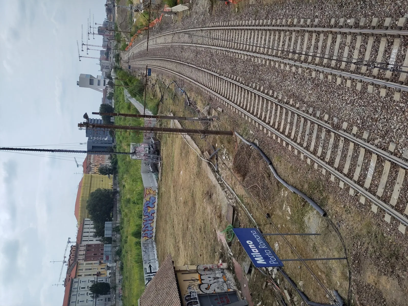 Aerial view of the Porta Romana railway yard (scalo) in Milan during redevelopment, one of the Scali Ferroviari sites.