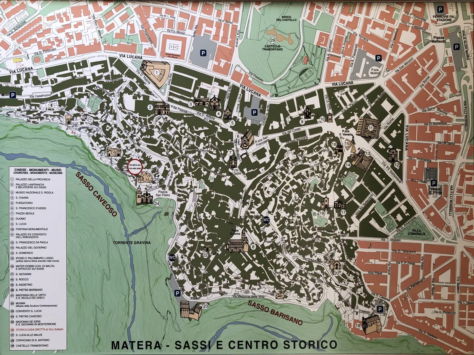 Plan/map of the Sassi di Matera (the two rupestrian districts Sasso Barisano and Sasso Caveoso around the Civita), showing the carved-and-built urban fabric. (Image is a photograph of an on-site orien