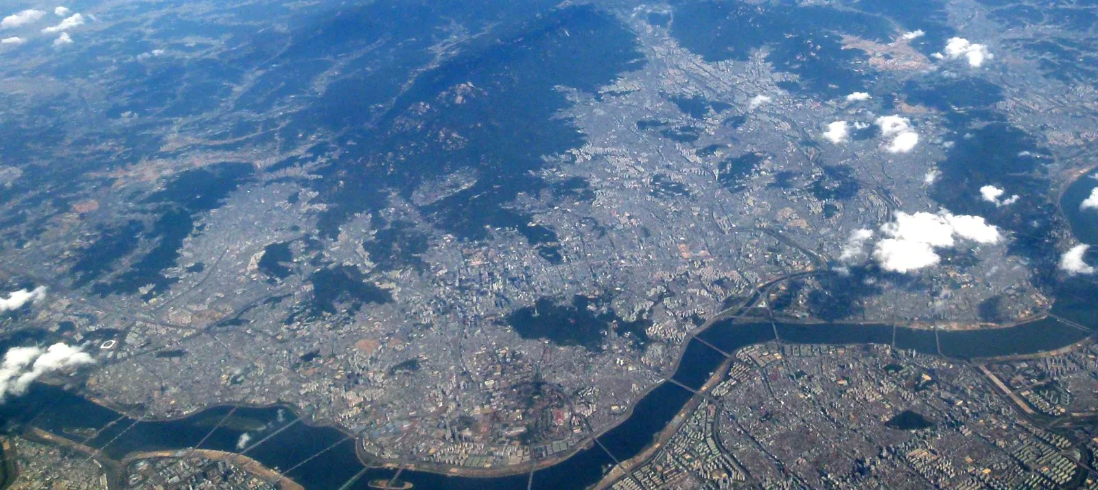 Aerial view over Seoul, including the Han River corridor south of which the Gangnam (Yeongdong) district was developed from 1970.