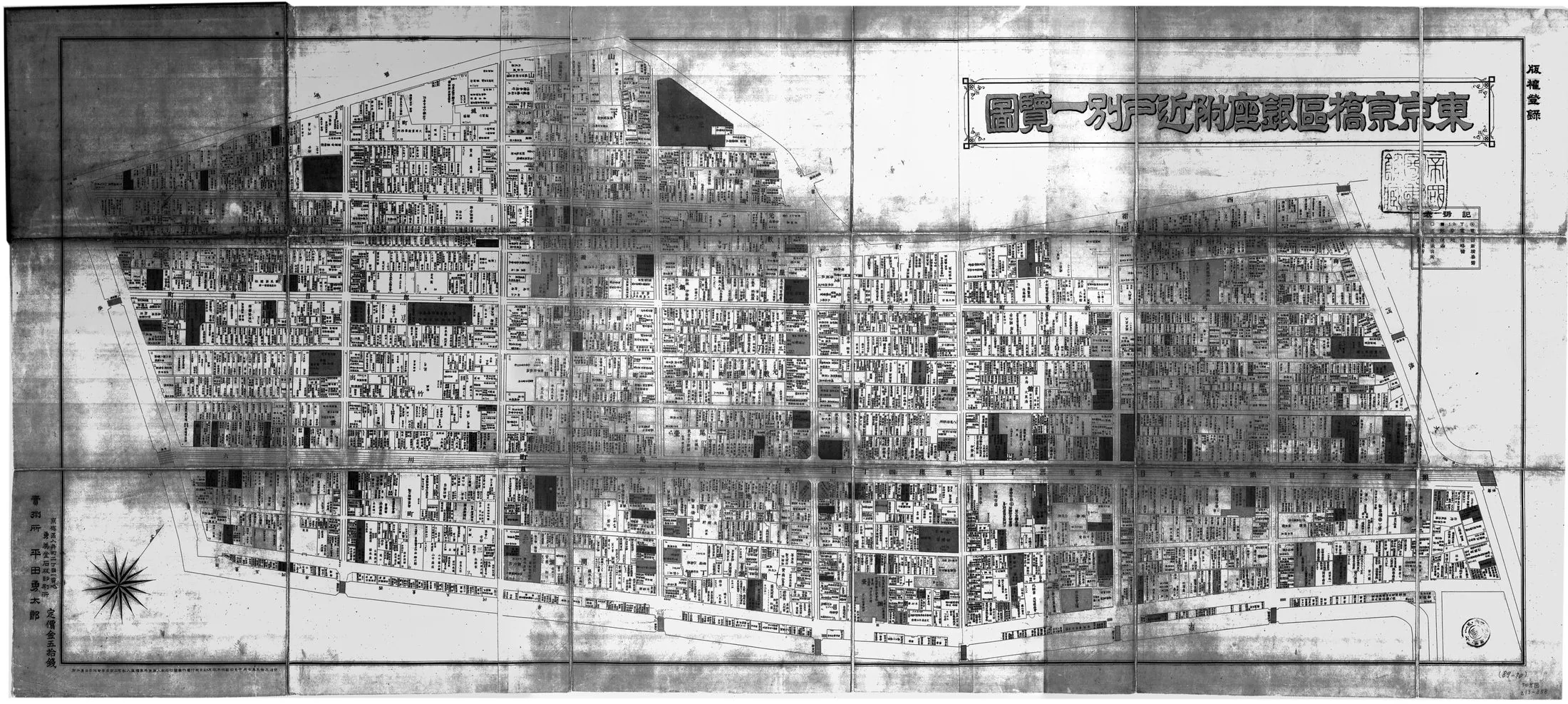 Plot-by-plot survey map of Ginza in Kyobashi ward, 1902: the rebuilt Renga-gai grid with the widened Ginza-dori and Kyobashi crossing, thirty years after the fireproof brick district was laid out.