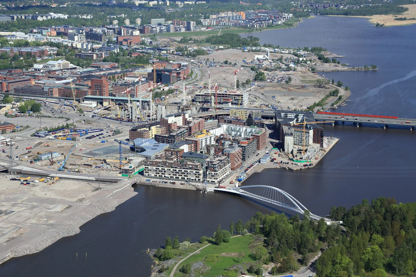 Aerial of Helsinki's Kalasatama district under construction (2016) on the former harbour, showing the dense transit-oriented block grid around the metro station of the City of Helsinki plan. The offic